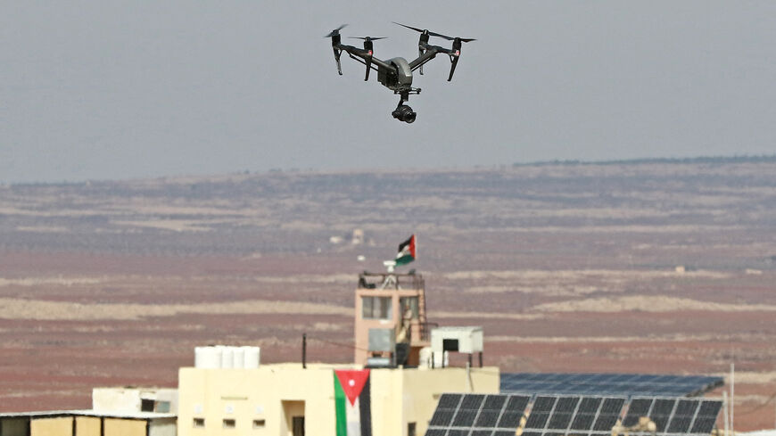 A picture taken during a tour origanized by the Jordanian Army shows a drone flying over an observation post along the border with Syria, on February 17, 2022. - Drug trafficking from Syria into Jordan is becoming "organised" with smugglers stepping up operations and using sophisticated equipment including drones, Jordan's army said, warning of a shoot-to-kill policy. Since the beginning of this year, Jordan's army has killed 30 smugglers and foiled attempts to smuggle into the kingdom from Syria 16 million